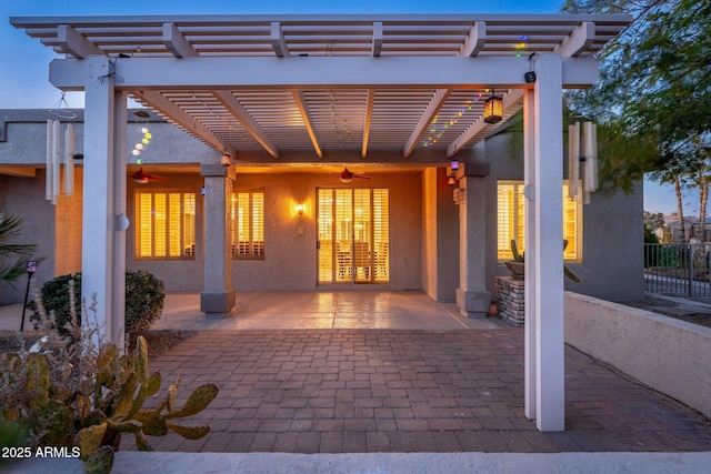 15583 W Big Sky Dr, Surprise, AZ 85374 - patio terrace at dusk featuring ceiling fan and a pergola