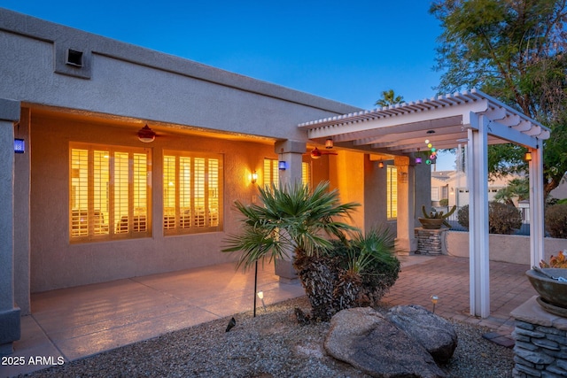 15583 W Big Sky Dr, Surprise, AZ 85374 - patio terrace at dusk featuring a pergola