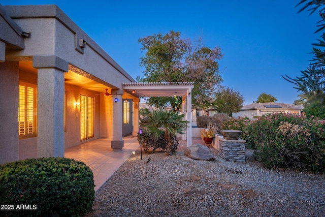 15583 W Big Sky Dr, Surprise, AZ 85374 - yard at dusk featuring a pergola and a patio area