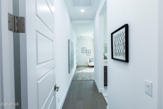 hallway with recessed lighting, visible vents, baseboards, and dark wood-style floors
