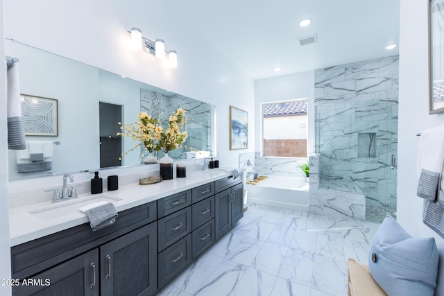 bathroom featuring a bath, marble finish floor, a sink, and visible vents
