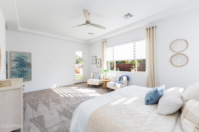 carpeted bedroom featuring visible vents, baseboards, access to outside, and a ceiling fan