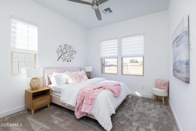 bedroom featuring visible vents, baseboards, a ceiling fan, and carpet floors