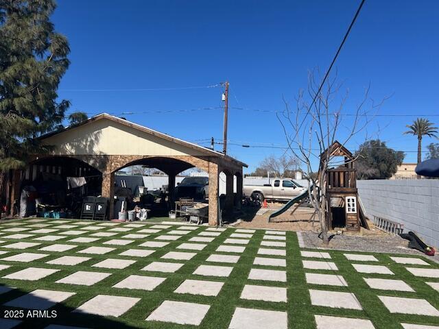6128 W Palmaire Ave, Glendale, AZ 85301 - view of yard with a playground, fence, and a gazebo