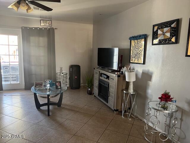 6128 W Palmaire Ave, Glendale, AZ 85301 - living room with a ceiling fan, healthy amount of natural light, and tile patterned floors