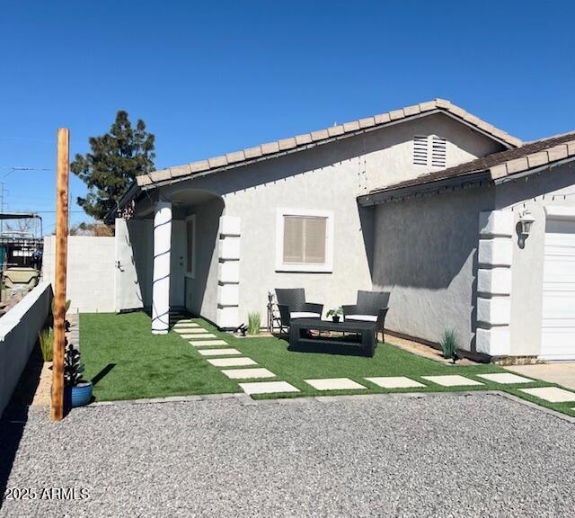 6128 W Palmaire Ave, Glendale, AZ 85301 - back of property with fence, stucco siding, and a patio
