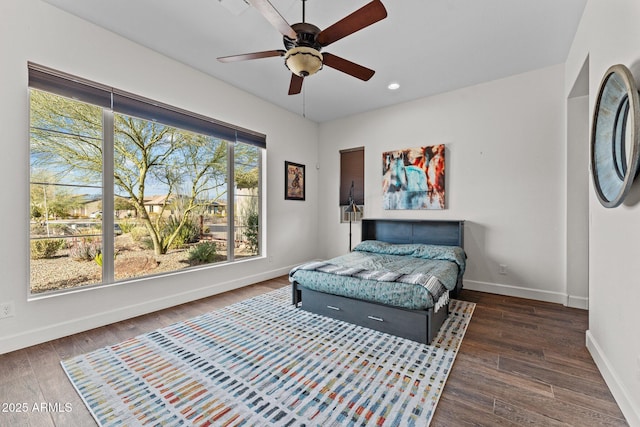 bedroom with recessed lighting, ceiling fan, baseboards, and wood finished floors