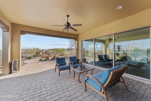 view of patio / terrace with a ceiling fan and an outdoor hangout area