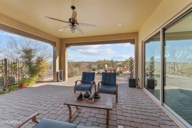 view of patio with a ceiling fan and a fenced backyard