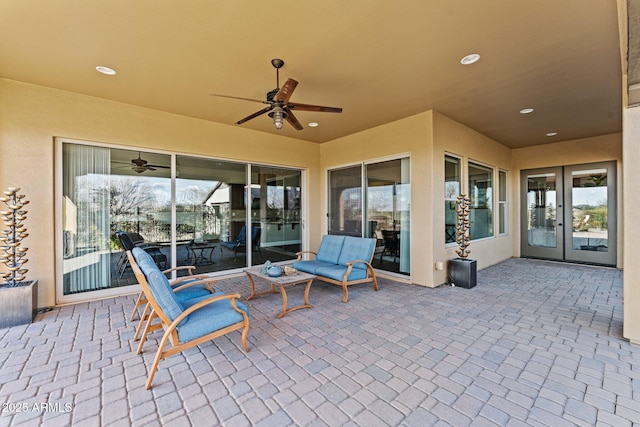 view of patio with french doors and ceiling fan