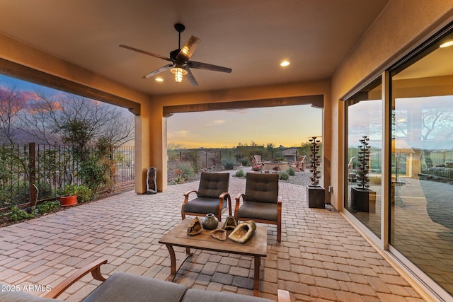 view of patio / terrace featuring a fenced backyard and a ceiling fan