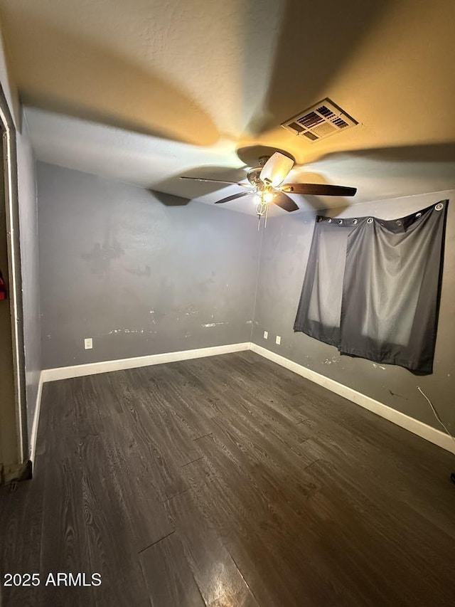 6429 W Palm Ln, Phoenix, AZ 85035 - empty room with wood finished floors and ceiling fan