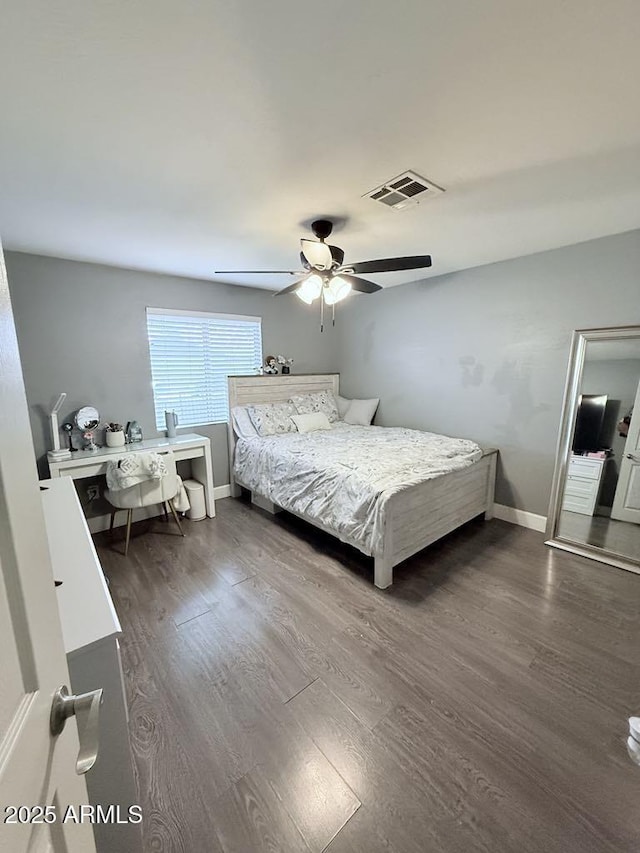 6429 W Palm Ln, Phoenix, AZ 85035 - bedroom featuring dark wood-style flooring, a ceiling fan, and an office area