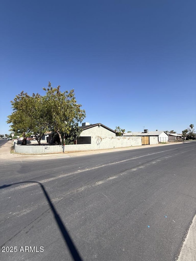 6429 W Palm Ln, Phoenix, AZ 85035 - view of asphalt street featuring curbs