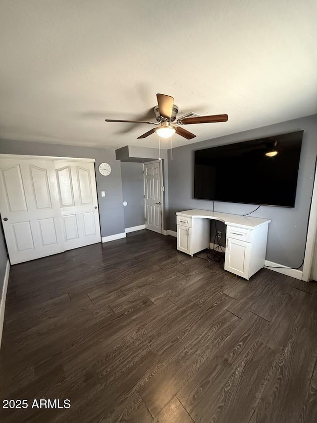 6429 W Palm Ln, Phoenix, AZ 85035 - unfurnished living room featuring dark wood finished floors, a ceiling fan, and an office area