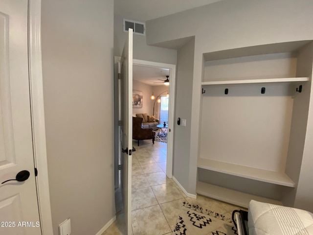 mudroom featuring light tile patterned floors and ceiling fan