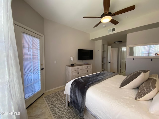 tiled bedroom featuring ceiling fan and access to exterior