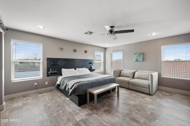 23211 N 22nd Pl, Phoenix, AZ 85024 - bedroom with a ceiling fan, baseboards, and wood finished floors