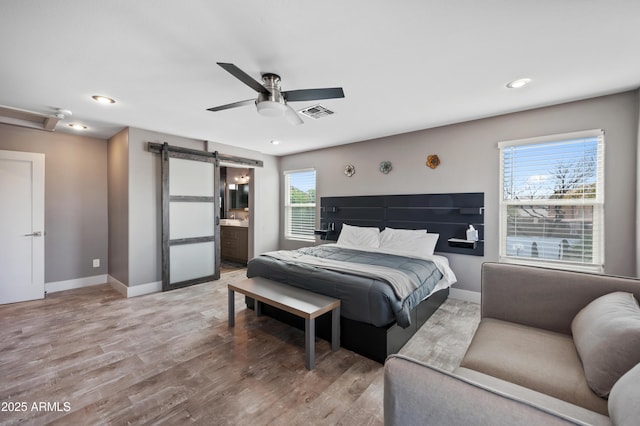 23211 N 22nd Pl, Phoenix, AZ 85024 - bedroom with light wood-style flooring, baseboards, a barn door, and visible vents