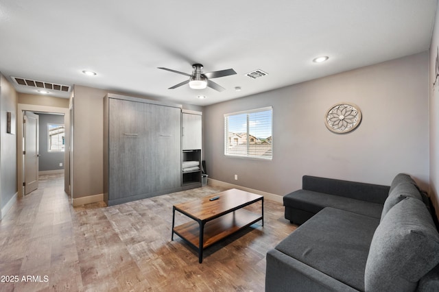 23211 N 22nd Pl, Phoenix, AZ 85024 - living area featuring baseboards, visible vents, light wood-style floors, and a ceiling fan