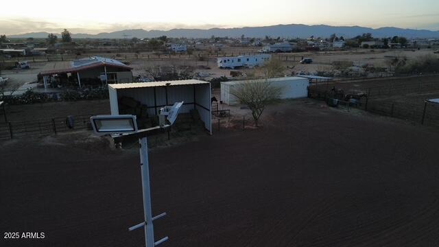 exterior space featuring a mountain view and fence