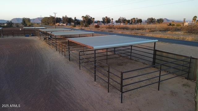 view of stable featuring a rural view