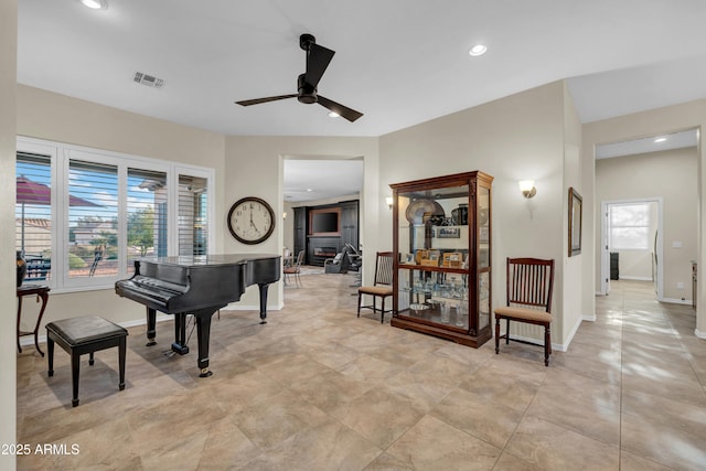 sitting room featuring recessed lighting, visible vents, ceiling fan, and baseboards