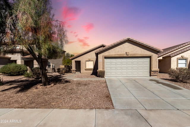 single story home featuring a garage