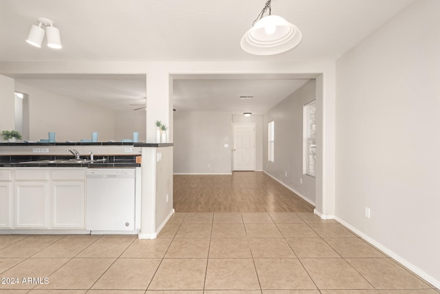 kitchen featuring ceiling fan, white cabinetry, dishwasher, pendant lighting, and light hardwood / wood-style floors