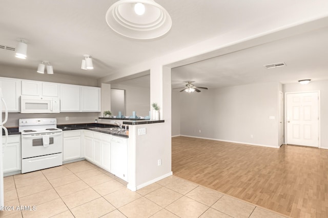 kitchen with white appliances, sink, white cabinetry, light hardwood / wood-style floors, and ceiling fan