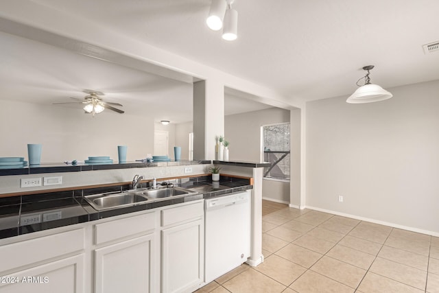 kitchen with sink, dishwasher, pendant lighting, white cabinets, and light tile patterned floors