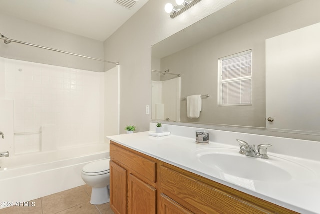 full bathroom with bathtub / shower combination, vanity, toilet, and tile patterned flooring