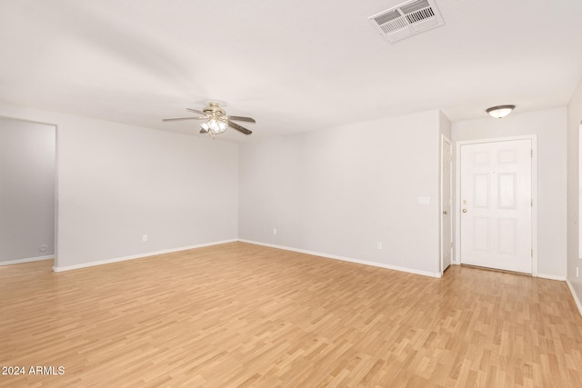 empty room with light hardwood / wood-style floors and ceiling fan