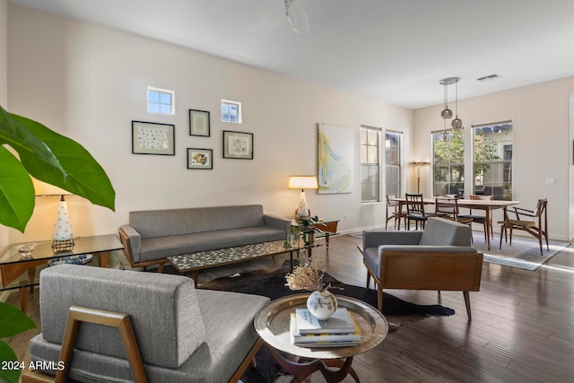 living room with dark hardwood / wood-style flooring