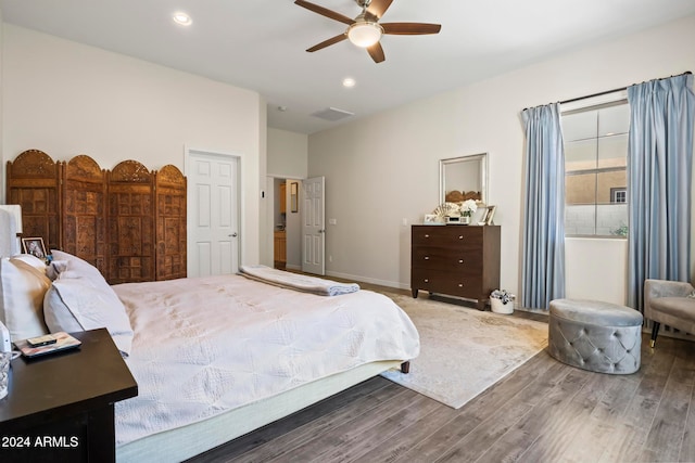 bedroom with hardwood / wood-style flooring and ceiling fan