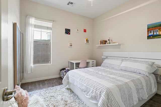 bedroom featuring dark wood-type flooring