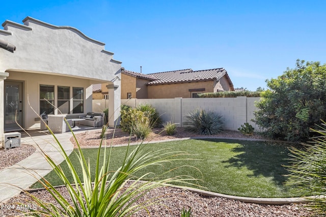 view of yard with an outdoor living space and a patio