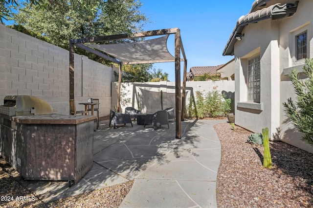 view of patio with grilling area and exterior kitchen