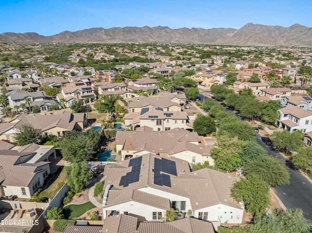 birds eye view of property with a mountain view