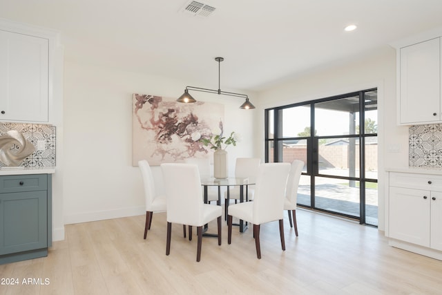 dining space featuring light hardwood / wood-style flooring