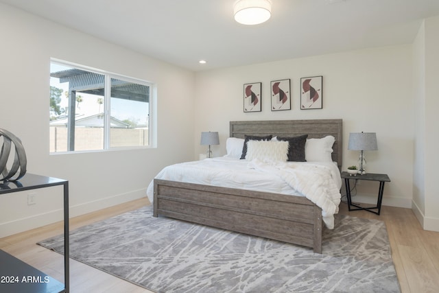 bedroom with light hardwood / wood-style floors