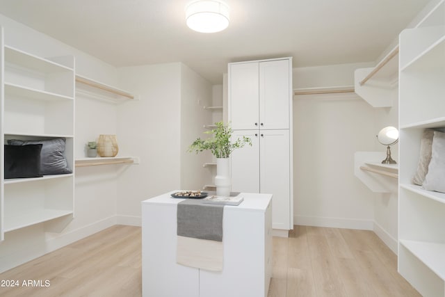 walk in closet featuring light wood-type flooring