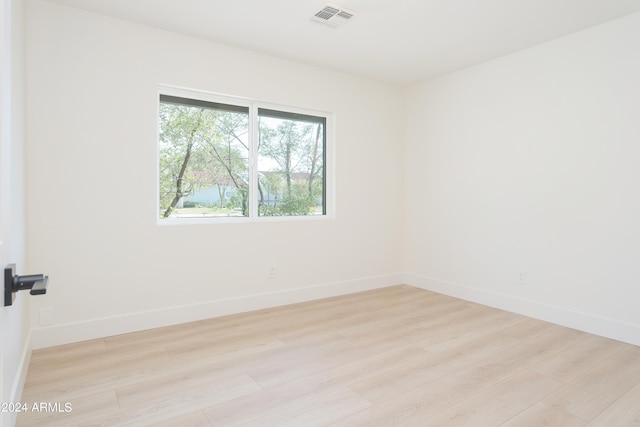 empty room with light hardwood / wood-style floors