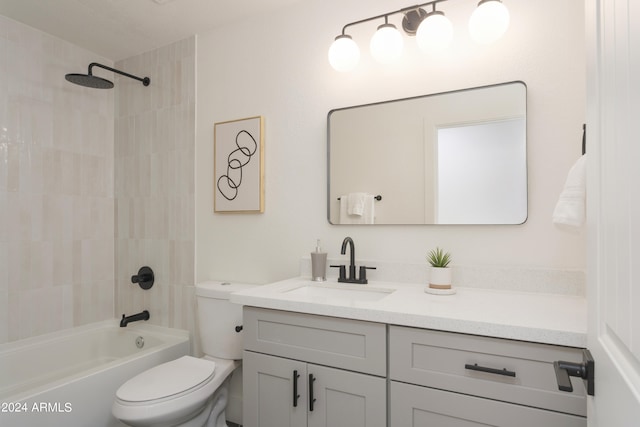 full bathroom featuring vanity, toilet, and tiled shower / bath combo