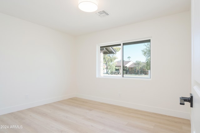 spare room with light wood-type flooring