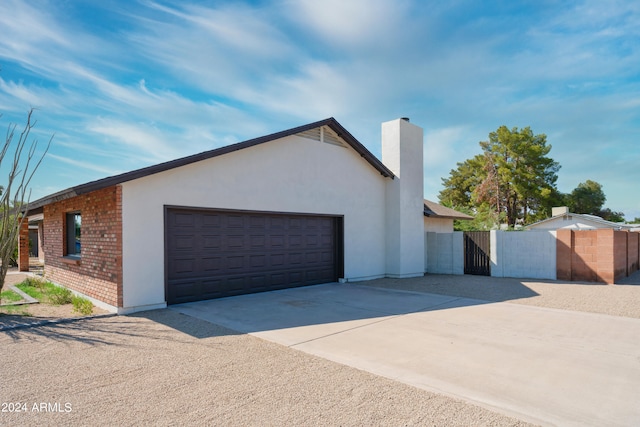 view of side of property featuring a garage