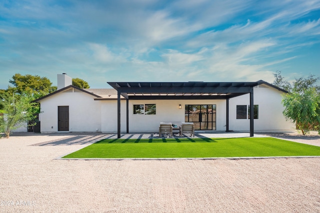 back of house featuring a yard and a patio