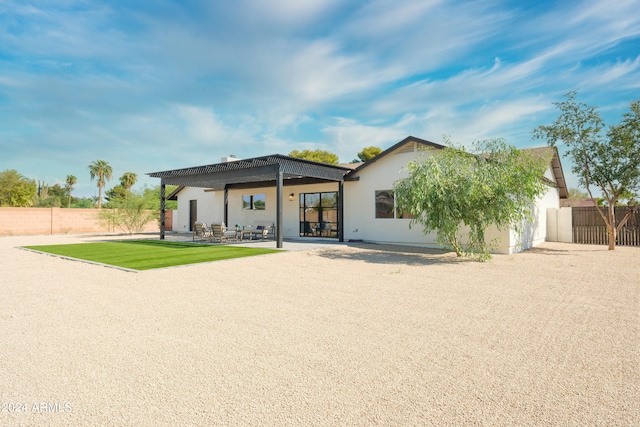 back of house with a patio area