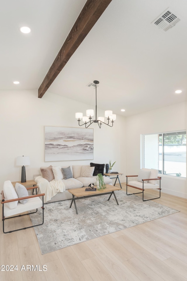 living room with lofted ceiling with beams, light hardwood / wood-style flooring, and a chandelier