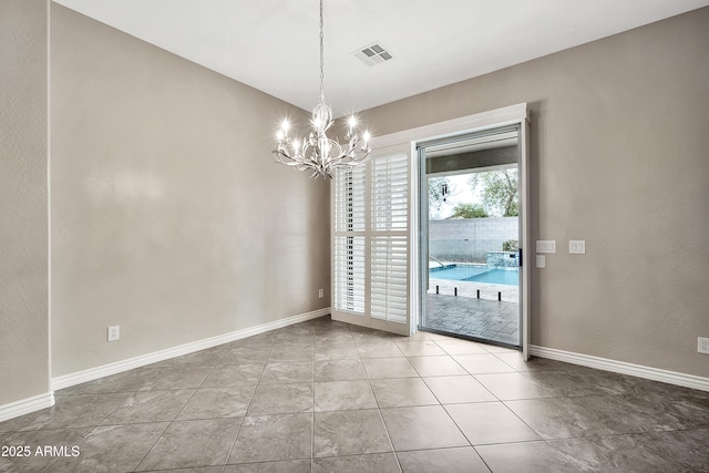 unfurnished dining area with tile patterned flooring, visible vents, baseboards, and an inviting chandelier